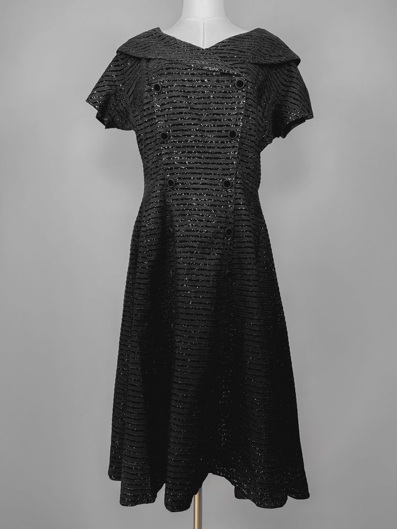Black 1950s-style Confetti Party Dress featuring a double-breasted design and a wide collar.