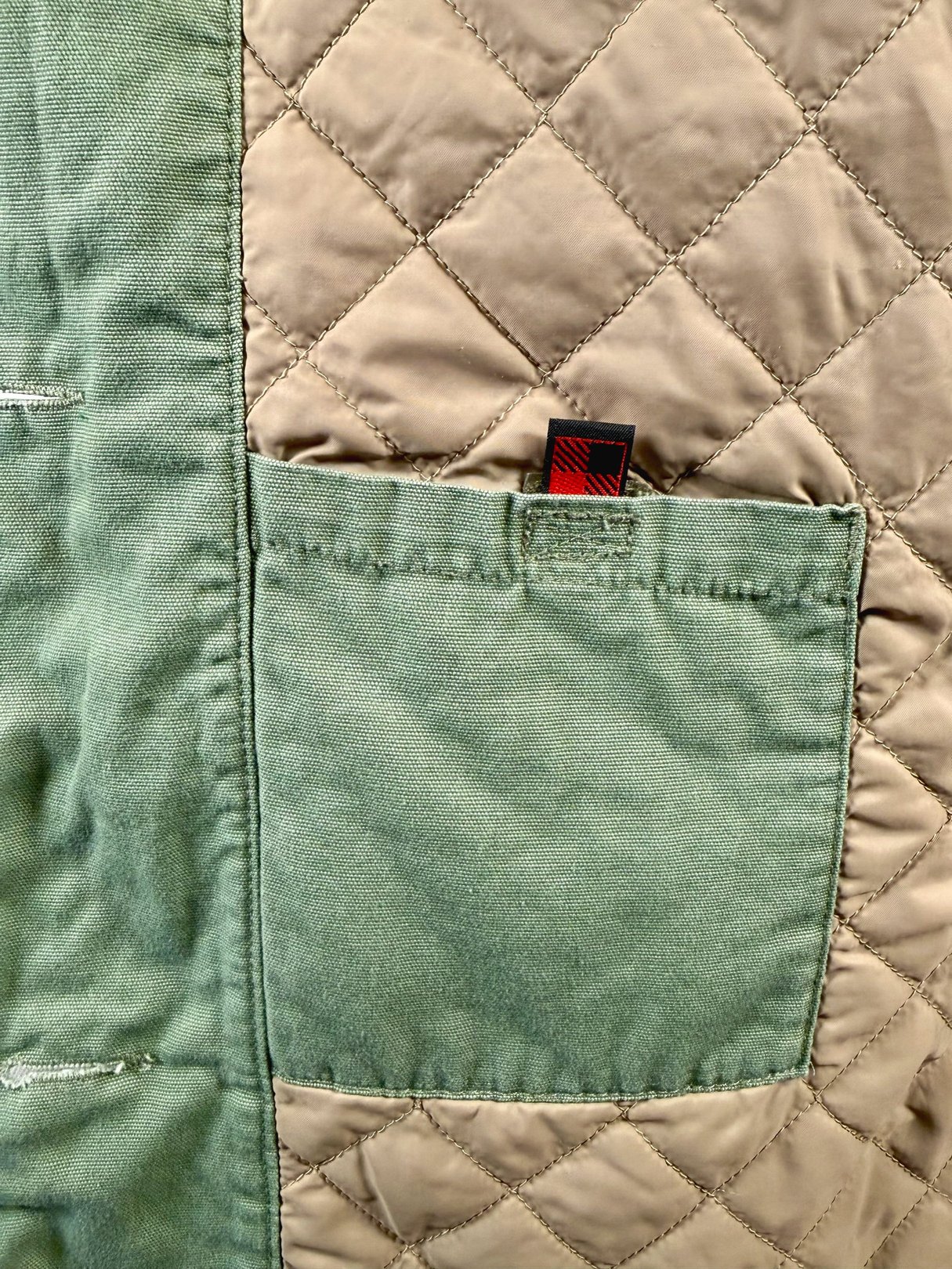 Sage quilted women's jacket featuring a patch pocket, reflecting a 1970s design.