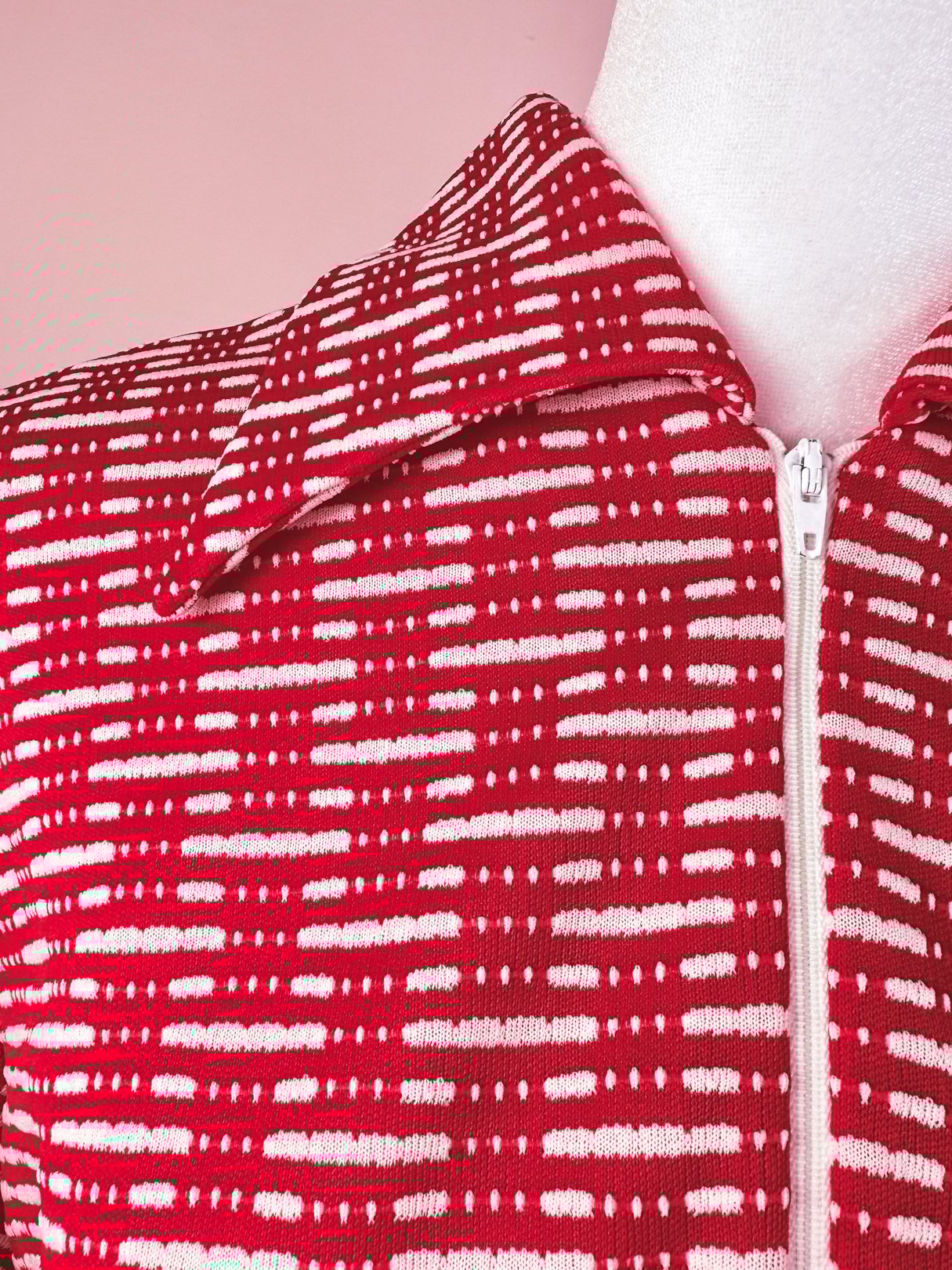 Red knit dress for women featuring a collar and a zipper, with a textured pattern, reflective of 1970s style.