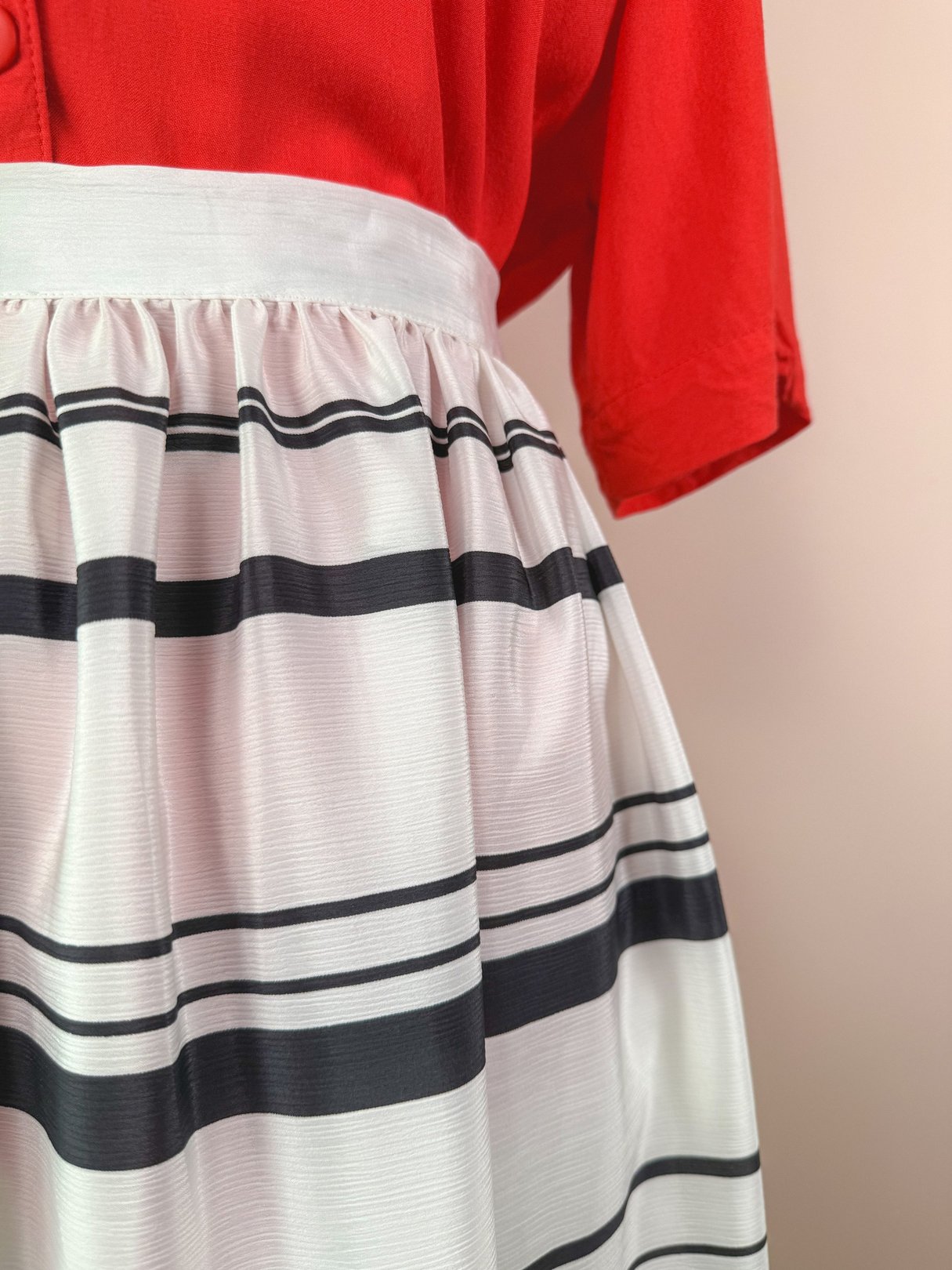 A women's 1970s Tide Line skirt in white with black stripes, featuring a gathered waist.