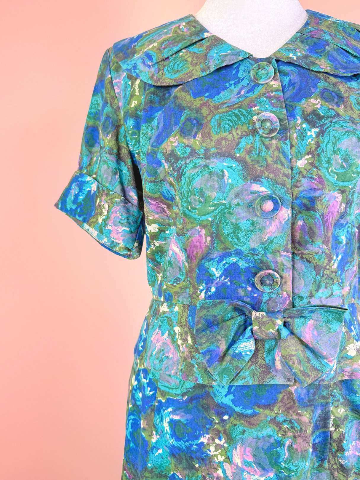 Blue floral skirt set for women with a 1950s-inspired design featuring a large collar and bow detail.