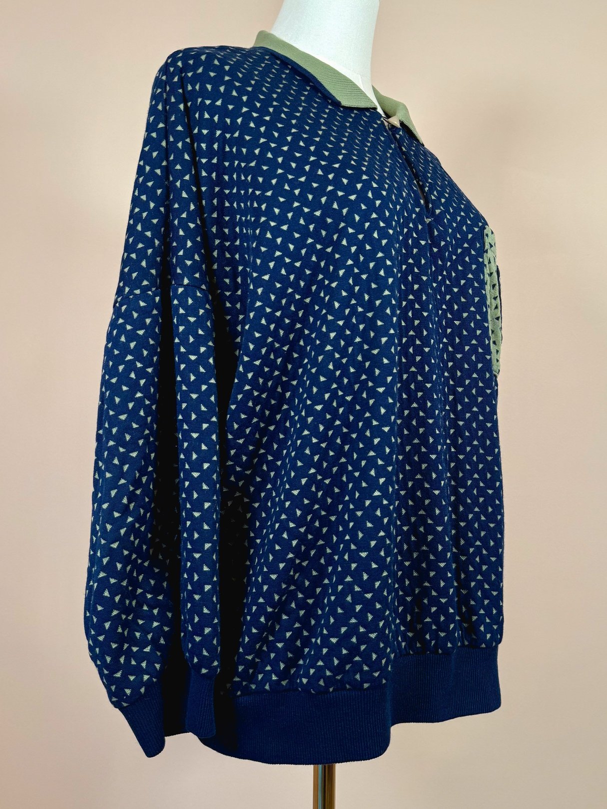 Navy blue women's triangle top from the 1980s featuring a geometric pattern and a collar.