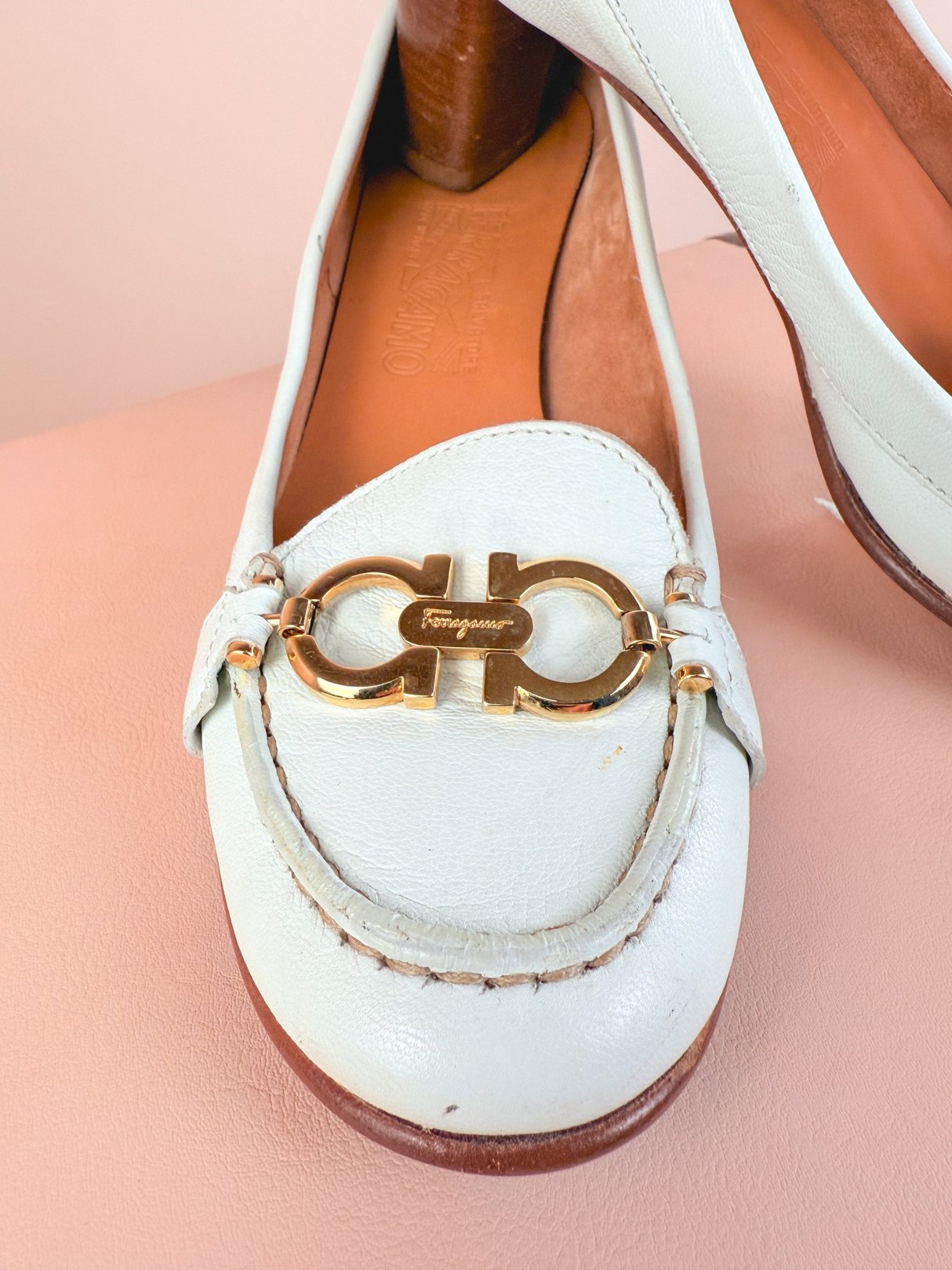 White women's Ferragamo Milano heels from the 1980s featuring a gold-tone buckle detail.