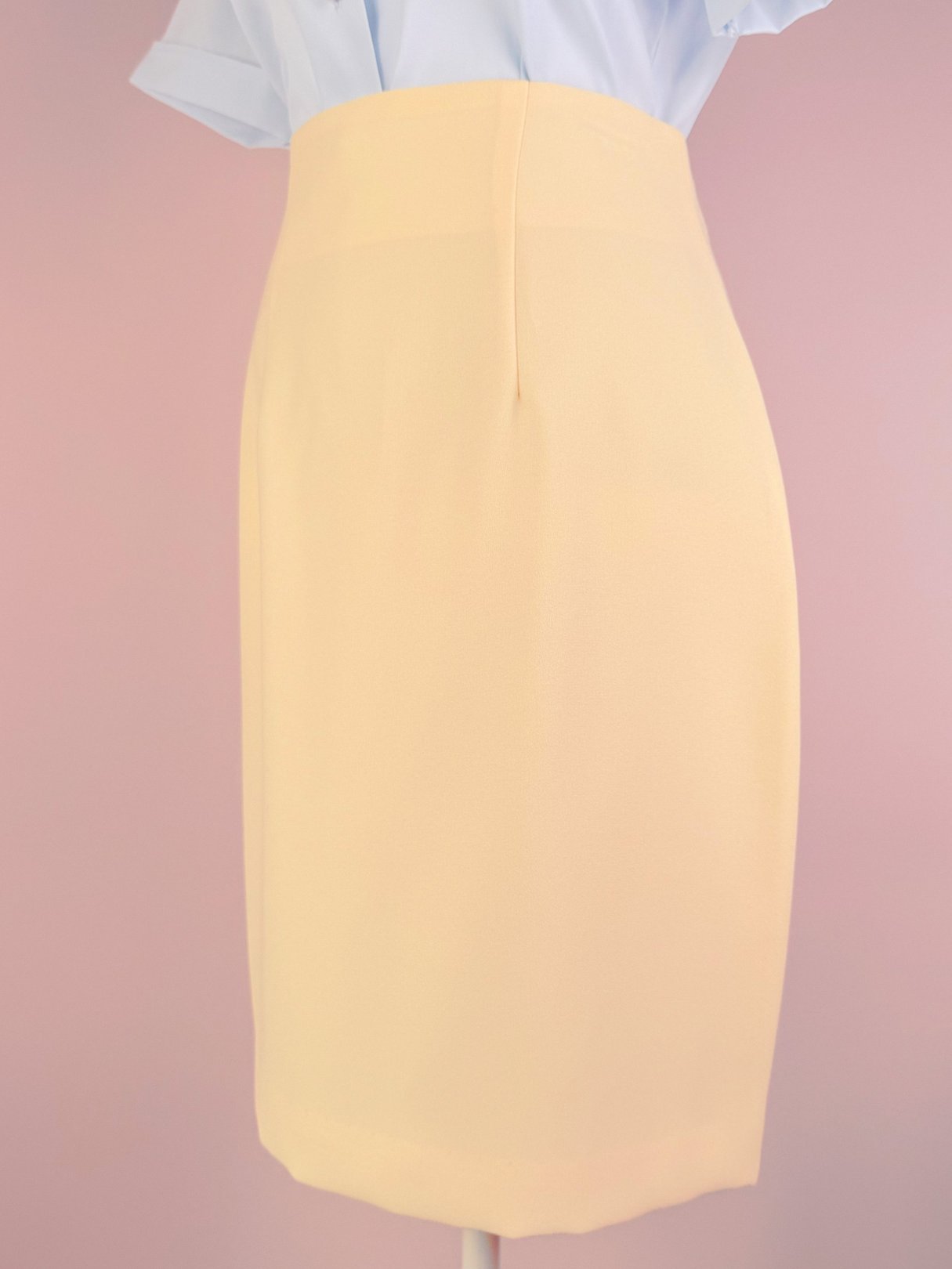 Buttery yellow 1990s women's skirt with a fitted silhouette.
