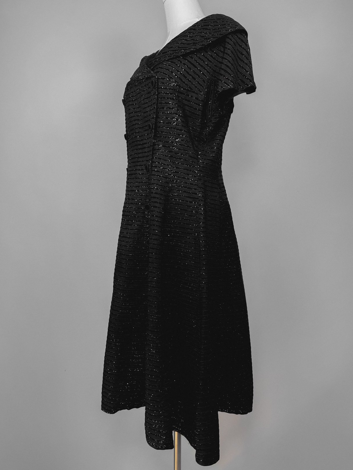 Black 1950s women’s Confetti Party Dress with a wide collar and a flared silhouette.