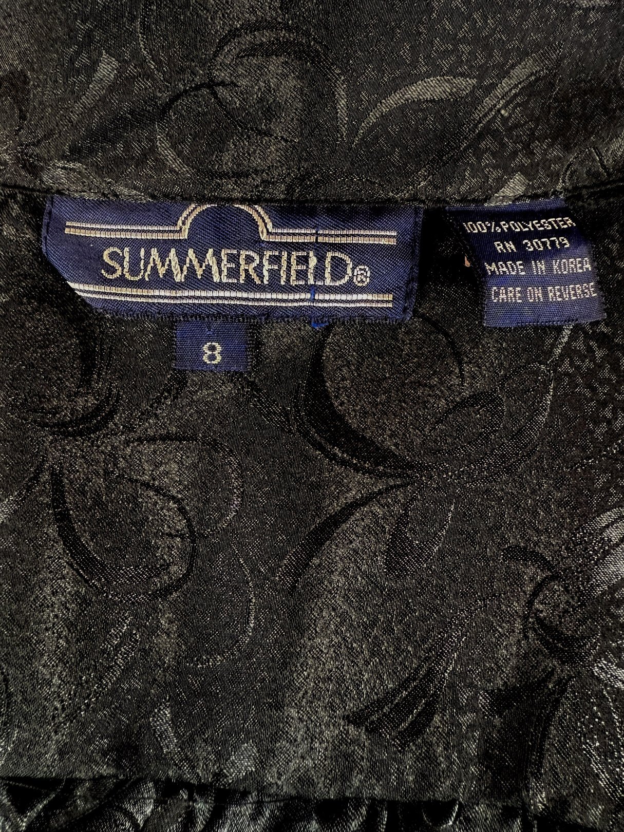 Black ink top for women from the 1980s featuring a bow detail, labeled size 8 by Summerfield, with a textured black fabric.