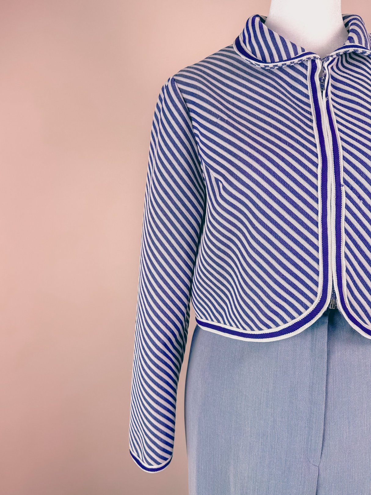 Navy blue and white striped 1960s women's Rue de Swing jacket featuring a round collar and a zippered front.