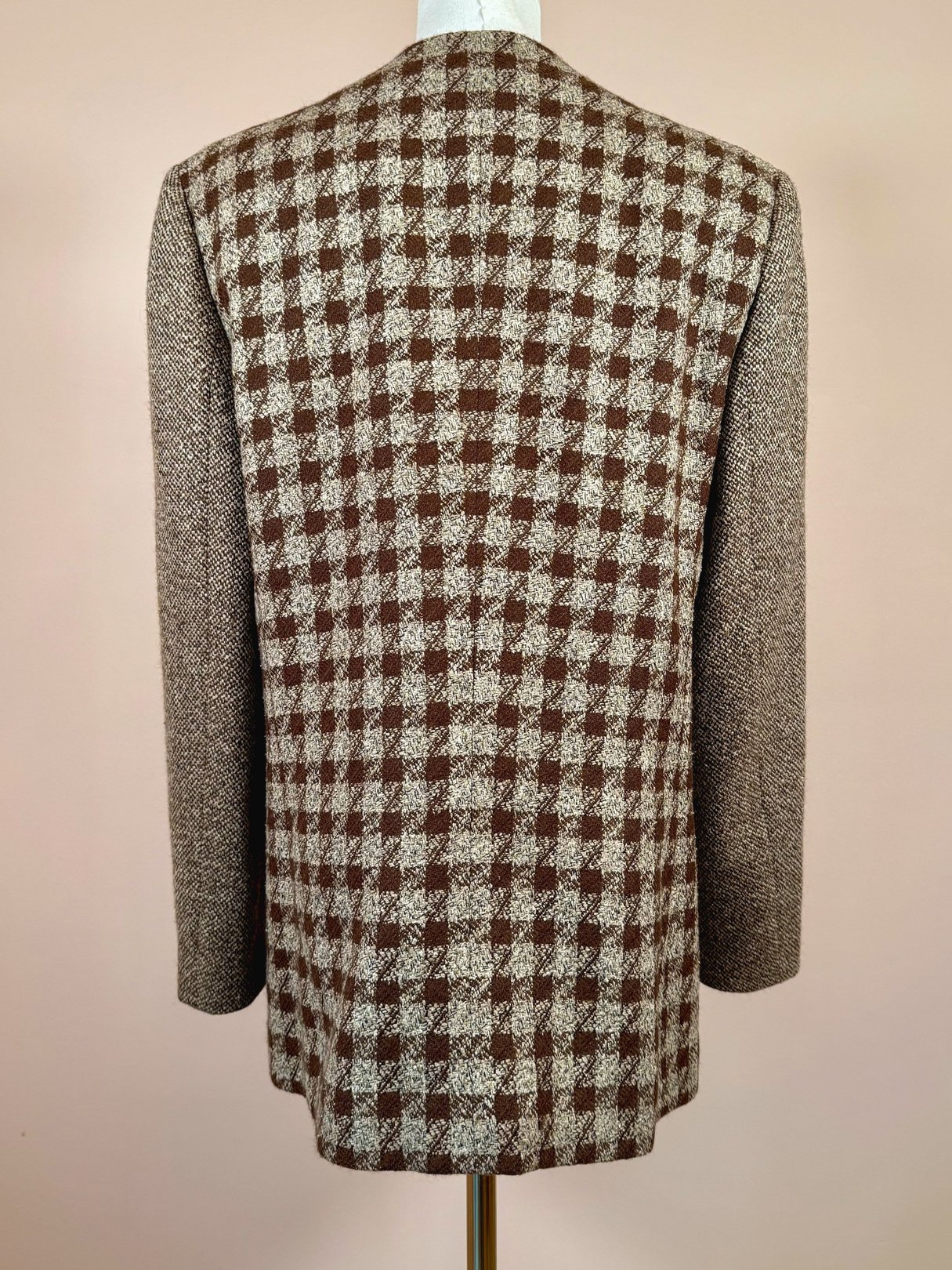 Brown tweed coat with a checked pattern, featuring long sleeves and a structured fit, styled for women from the 1990s.