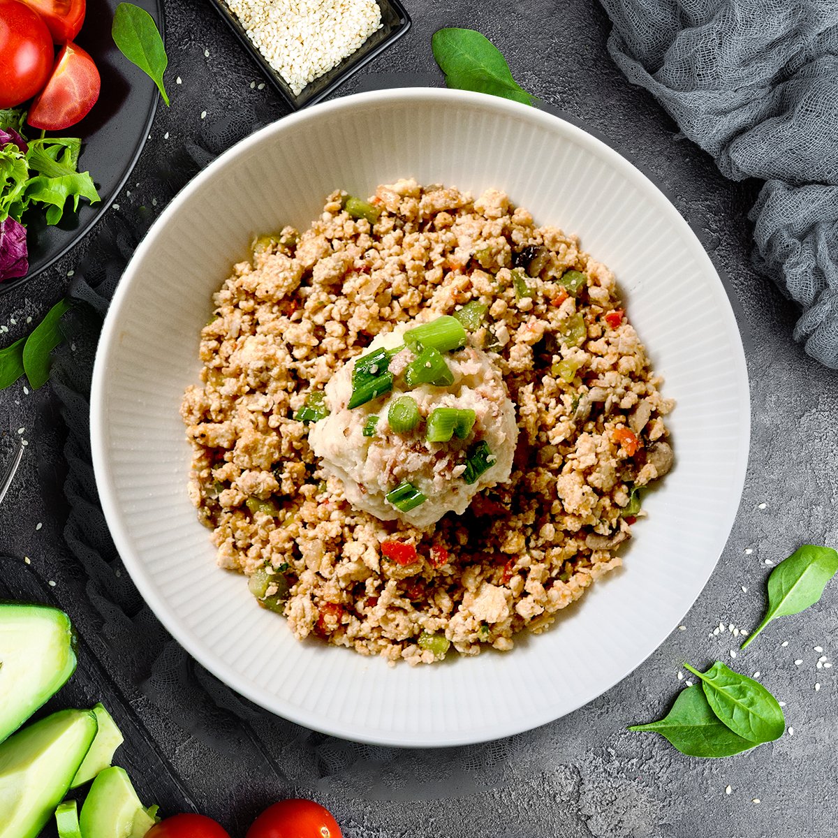 Juicy, tender antibiotic-free chicken thighs sautéed with sweet bell peppers, hearty mushrooms, and onion in a savory homemade chicken stock nestled over a fluffy cauliflower rice base with smoky, crispy uncured chicken bacon woven throughout.