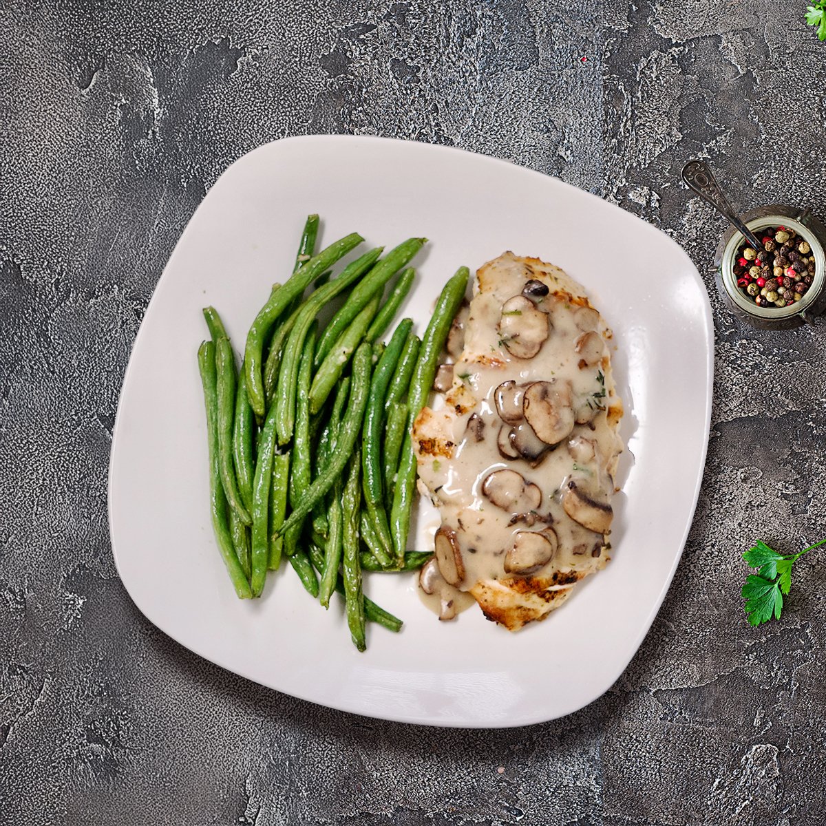 Golden pan-seared antibiotic-free chicken breast simmered in a rich Marsala wine sauce with earthy crimini mushrooms, shallots, fresh garlic, and a silky house-made chicken stock — finished with butter, Dijon mustard, and fresh herbs for a deeply satisfying, classic Italian-American plate.