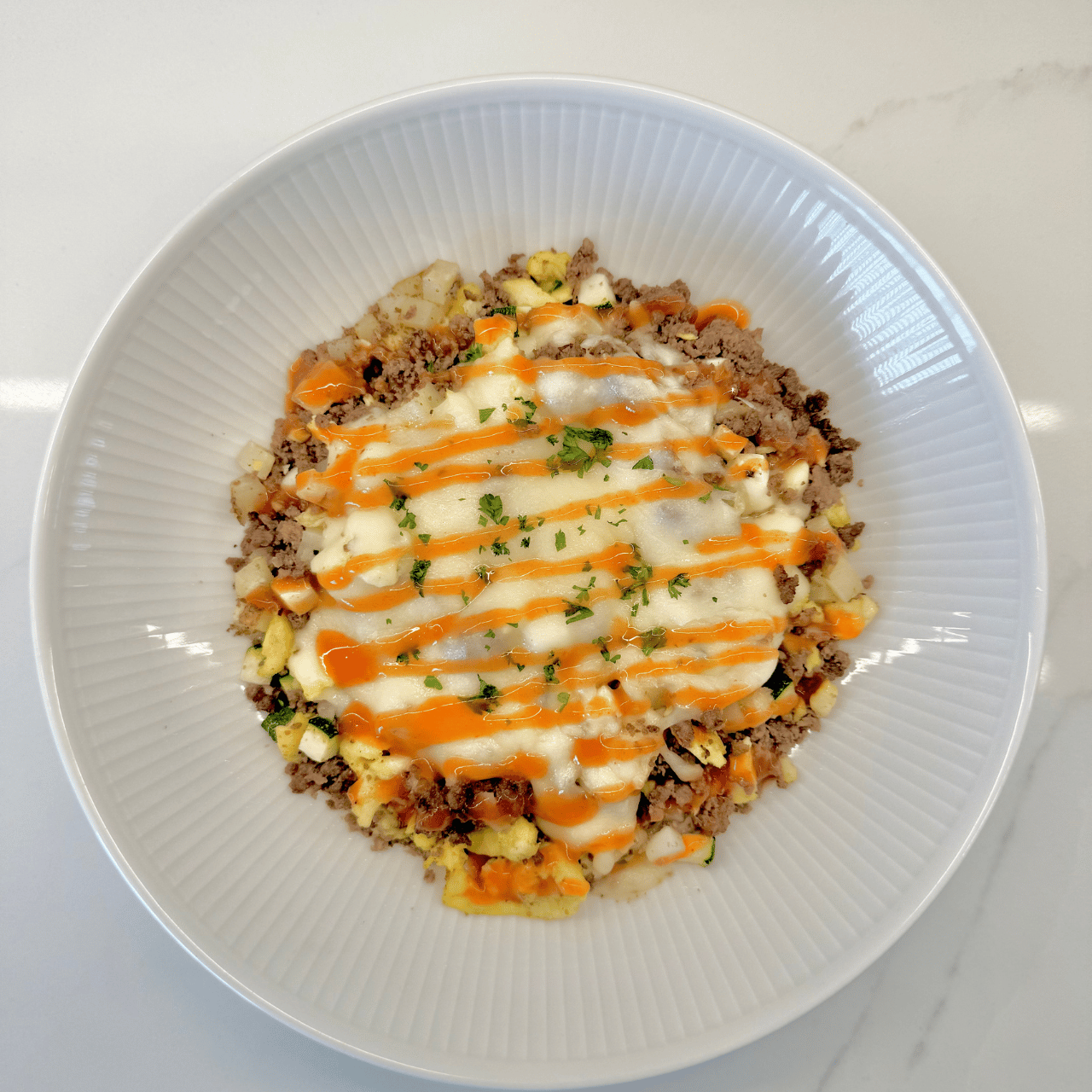 Served with a side of hot sauce, this skillet is the perfect balance of savory goodness with a hint of spice.