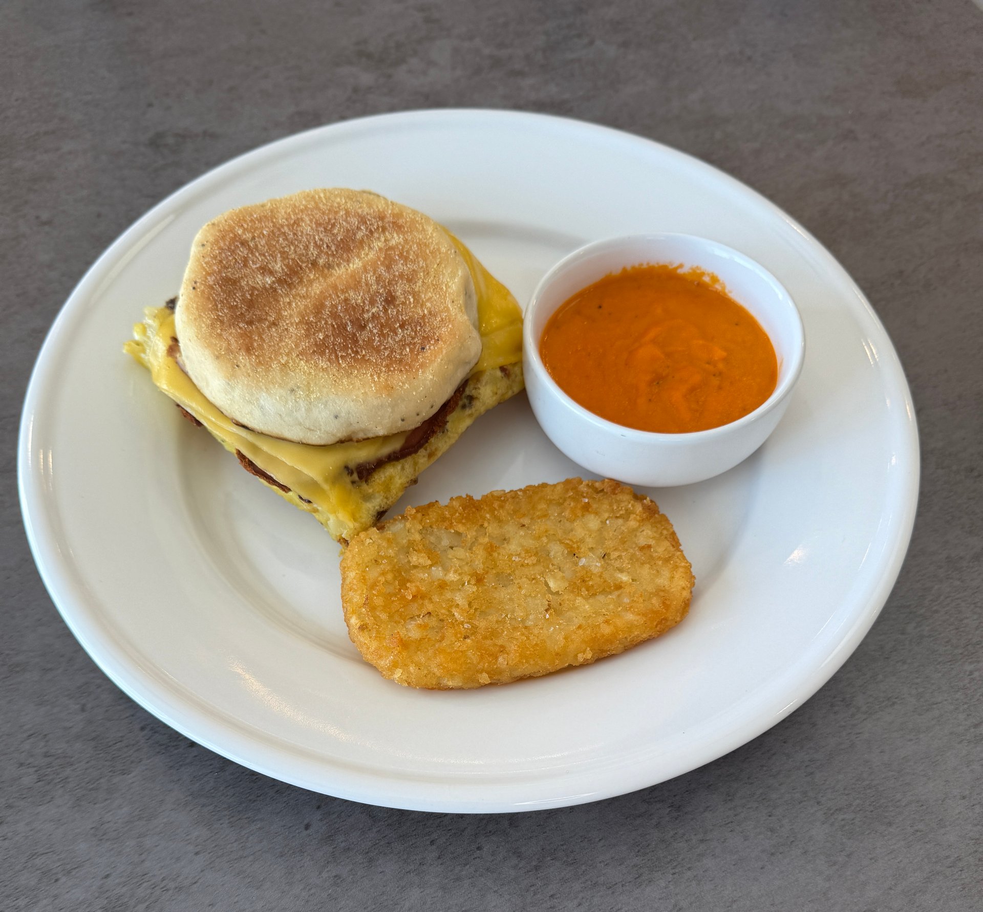 Macros include portioned sauce cup. Roasted Tomato Butter Sauce Cup: Calories: 80, Fat 8g, Carbs:2g, Protein: 0g, Sodium 2mg