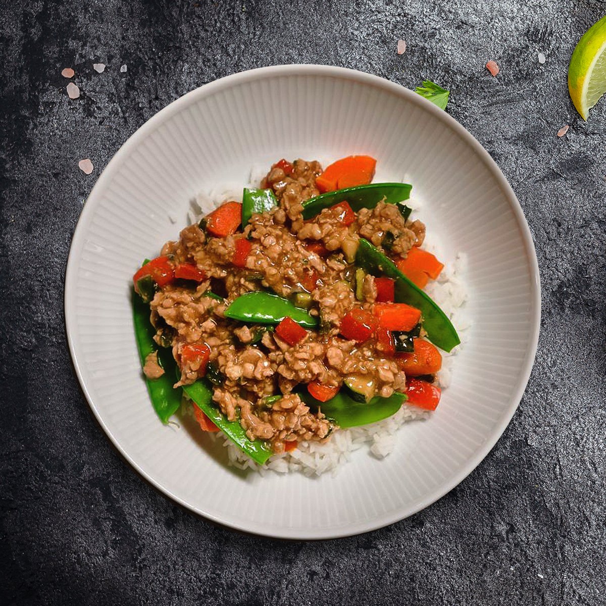 Juicy, tender antibiotic-free chicken thighs sautéed with crisp snow peas, vibrant red bell peppers, zucchini, and carrots in a rich, savory sauce of coconut aminos, tamari, toasted sesame oil, fresh ginger, and garlic.