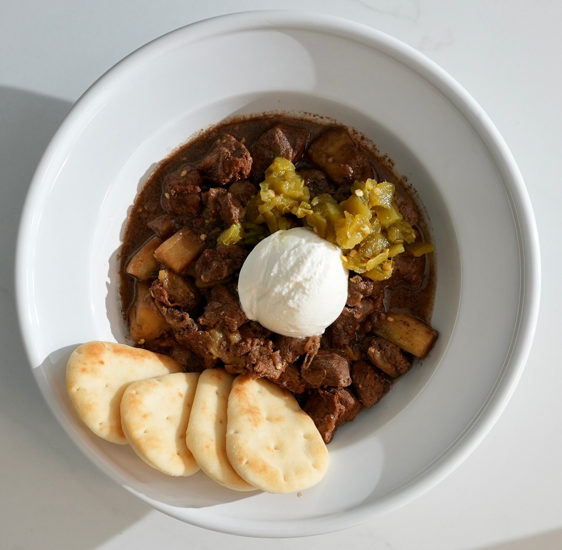 Lamb and eggplant gyro bowl with Mediterranean grains, tzatziki, tomatoes and cucumber