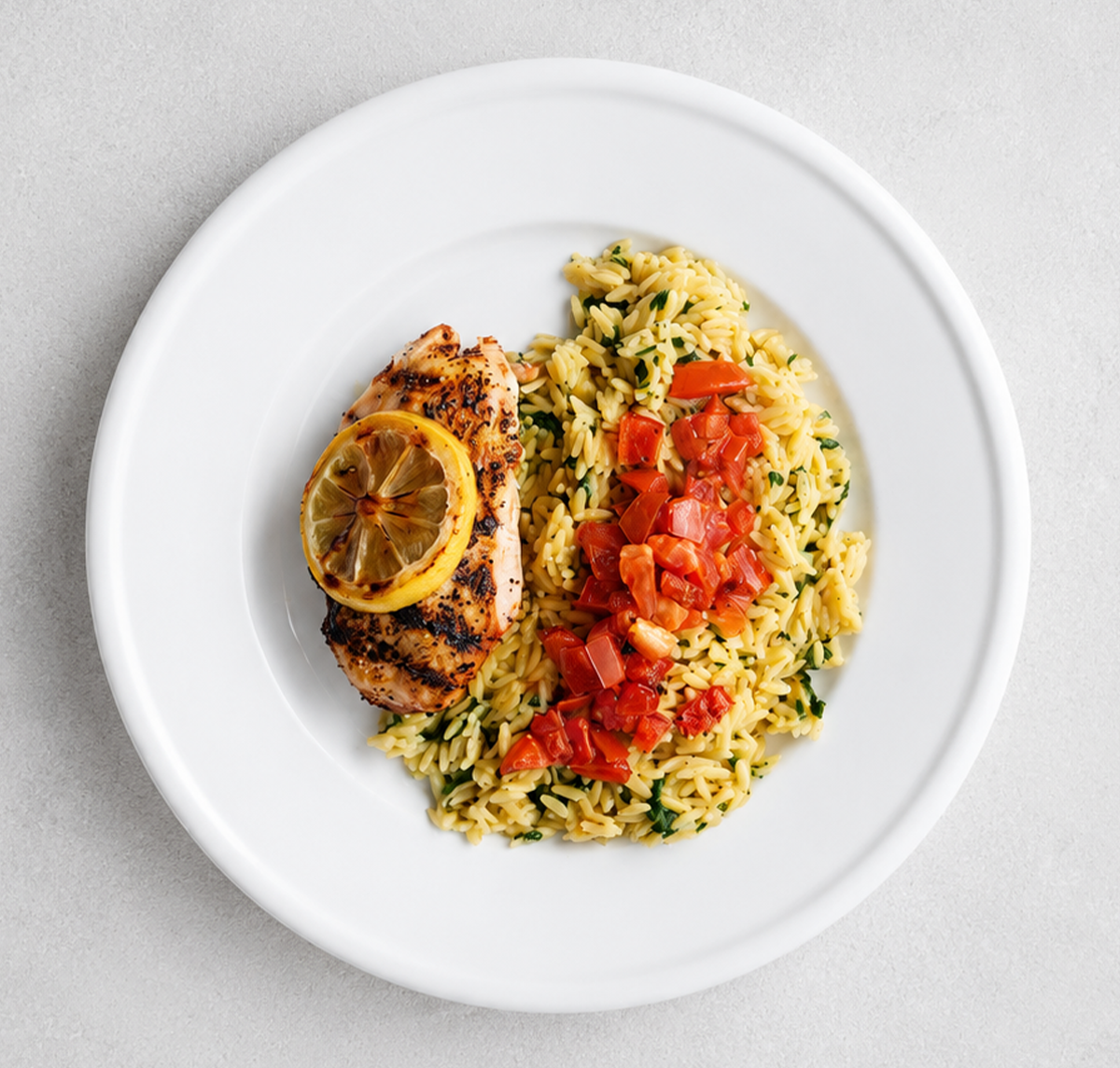 Bright and savory lemon pepper chicken topped with fresh citrus, perfectly balanced by the natural sweetness of roasted tomatoes.
