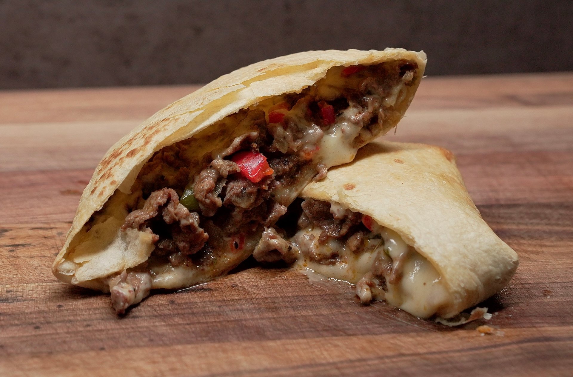 Indulge in our Philly inspired Crunch Wrap, a bold twist on a classic favorite.