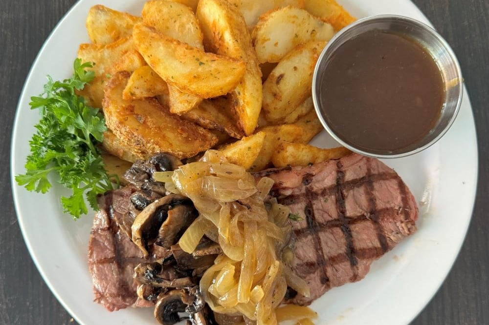 O'Grady's Loaded 8oz NY Striploin Served With fries, Vegetables, Sautéed Onions & Mushrooms
