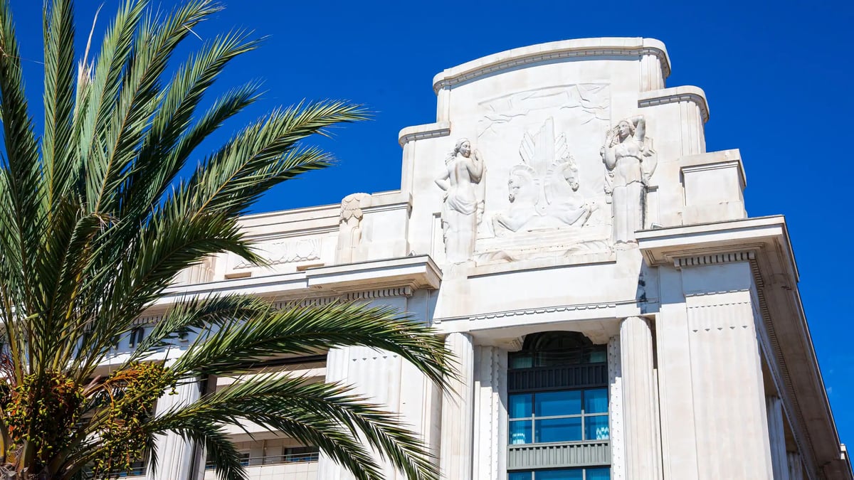 Art Deco facade and Mediterranean setting of Hôtel Palais de la Méditerranée