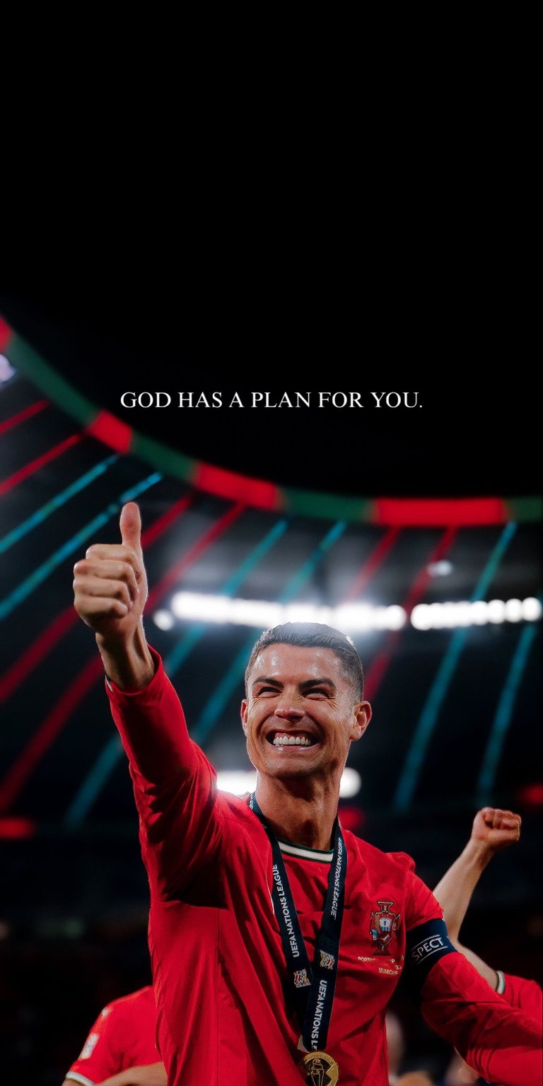 Download this Ronaldo 4K wallpaper for your iPhone, featuring the soccer star with a winning smile, giving a thumbs up, and wearing a medal. This incredible wallpaper is perfect for any fan.