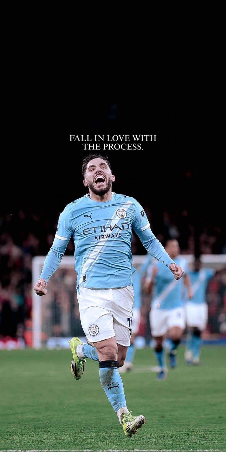 This high-quality 4K wallpaper features Jack Grealish in his Manchester City kit celebrating on the pitch. The aesthetic wallpapers design for iPhone utilizes a deep black background to highlight the vibrant sky blue jersey and cinematic stadium lighting.