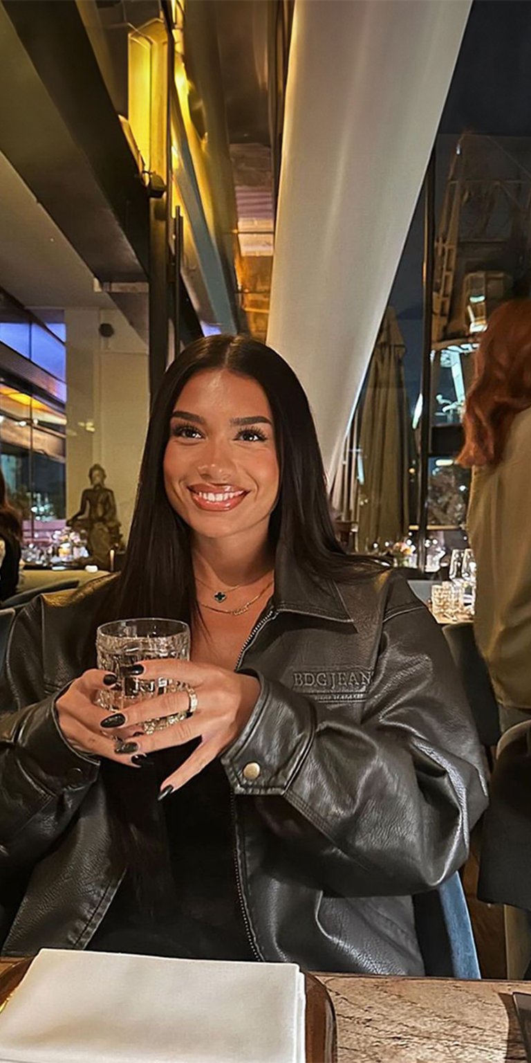 Lady in the restaurant smiling wallpaper for mobile