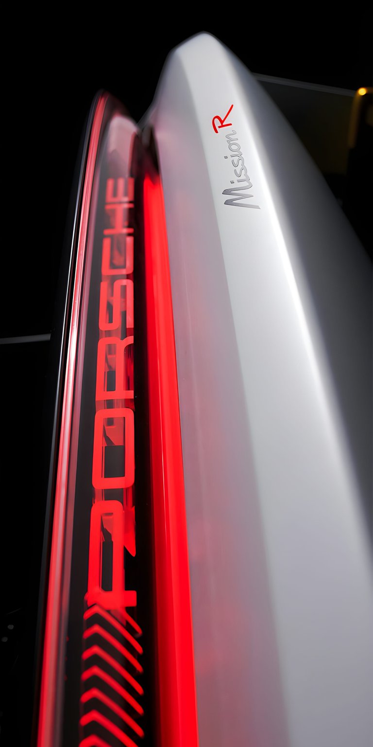 This 4K wallpaper features the sleek, illuminated rear light strip of the Porsche Mission R concept. Designed specifically as an OLED wallpapers choice for iPhone, it showcases vibrant red neon against a deep black background for high-contrast depth.