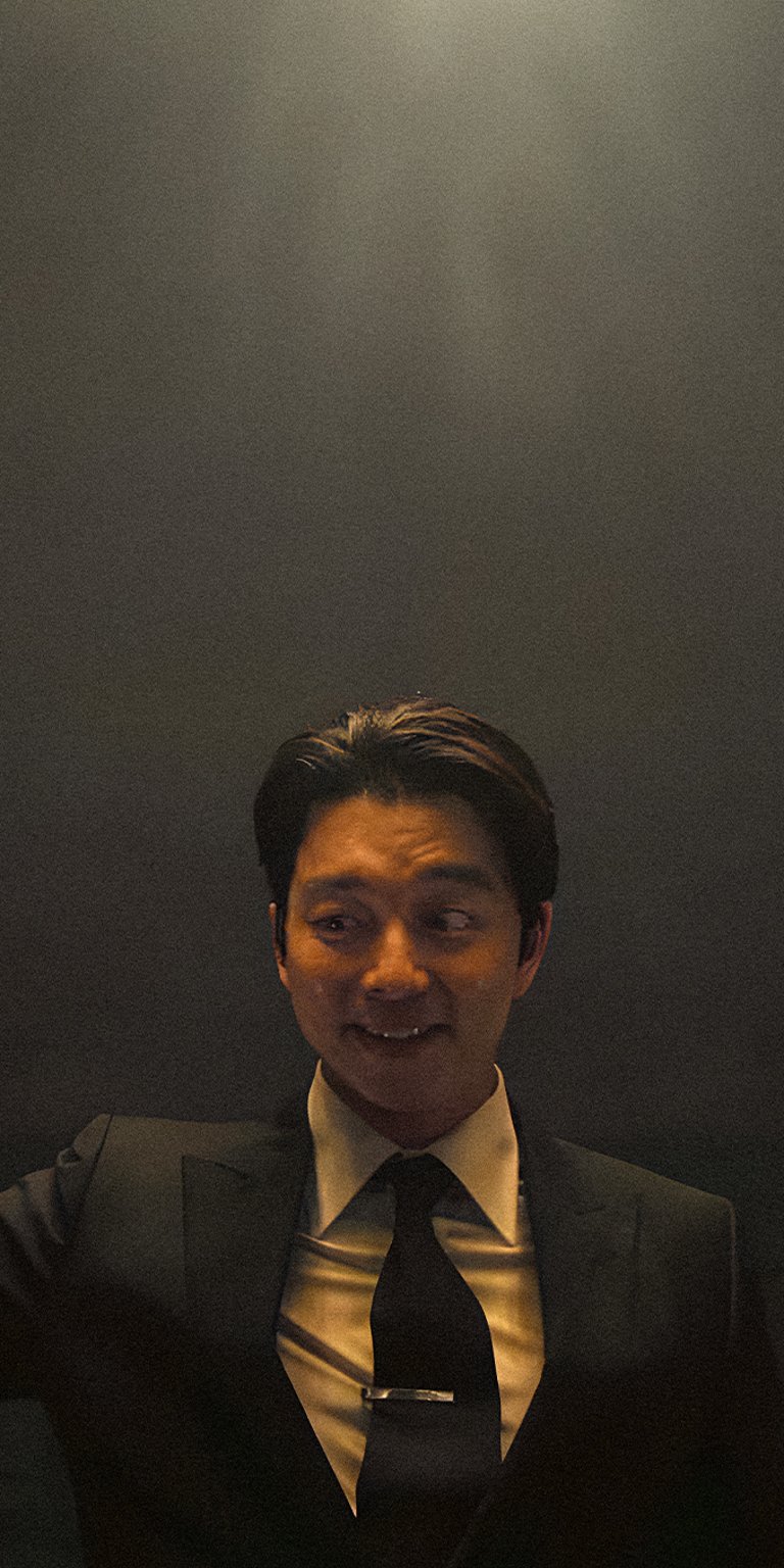 Salesman guy in dark room smiling wallpaper