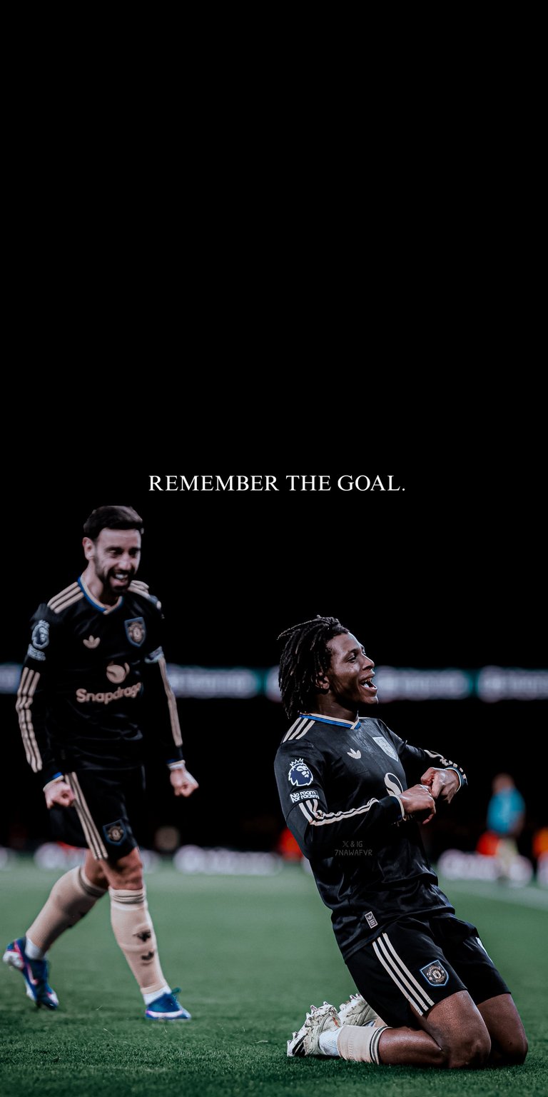 This Manchester United 4K wallpaper is optimized for iPhone displays using deep blacks perfect for OLED wallpapers. The visual features Kobbie Mainoo celebrating a goal alongside Bruno Fernandes under a high-contrast motivational quote.