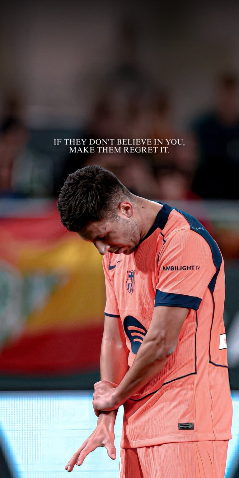 This dramatic live wallpaper, featuring a player tagged with the name Rooney, shows a powerful moment of reflection or dejection. The player, in the distinctive orange and navy FC Barcelona kit, is captured with his head bowed, conveying a sense of disappointment or intense focus. An overlay quote reads: "If they don't believe in you, make them regret it." This wallpaper captures the high emotional stakes of professional football.