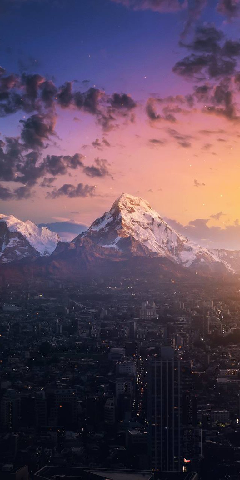 Large City with ice mountain at the background phone wallpaper
