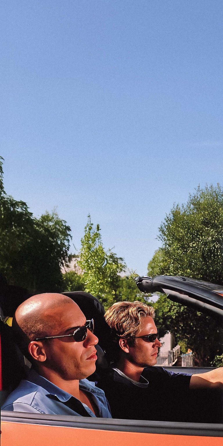 Paul Walker and Vin Diesel sitting in orange Toyota Supra wallpaper 4k