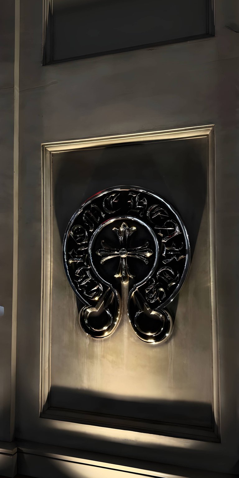 Elevate your mobile aesthetic with this 4K wallpaper featuring the iconic Chrome Hearts silver cross logo. This premium 4K wallpaper captures luxury metal textures and high-end fashion branding for a sleek phone look.