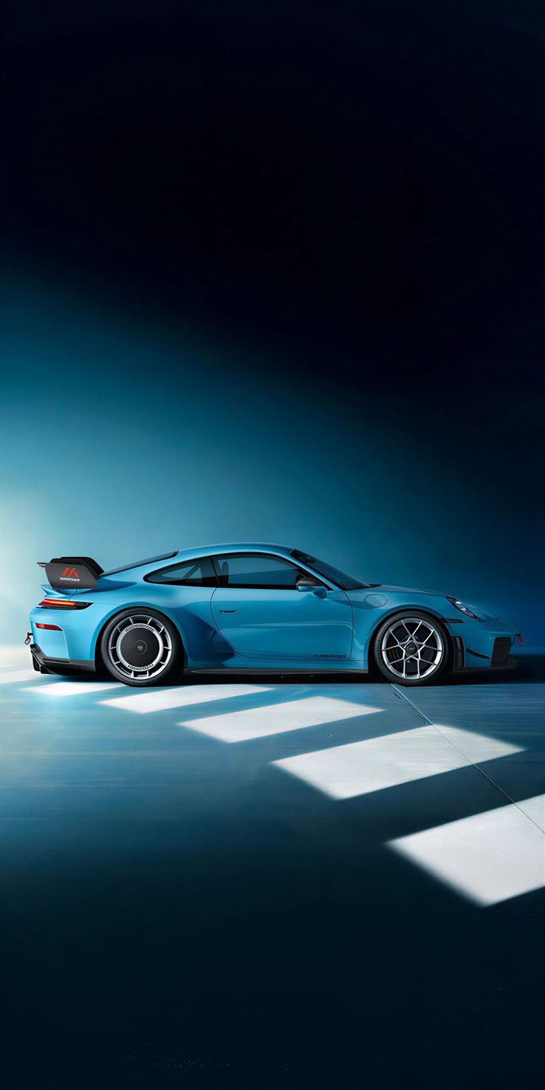 Download this stunning Porsche GT3 4K wallpaper for your iPhone, featuring a light blue paint job. Notice the contrasting wheel designs and the bold spoiler for a stylish look. This wallpaper is perfect for car enthusiasts.