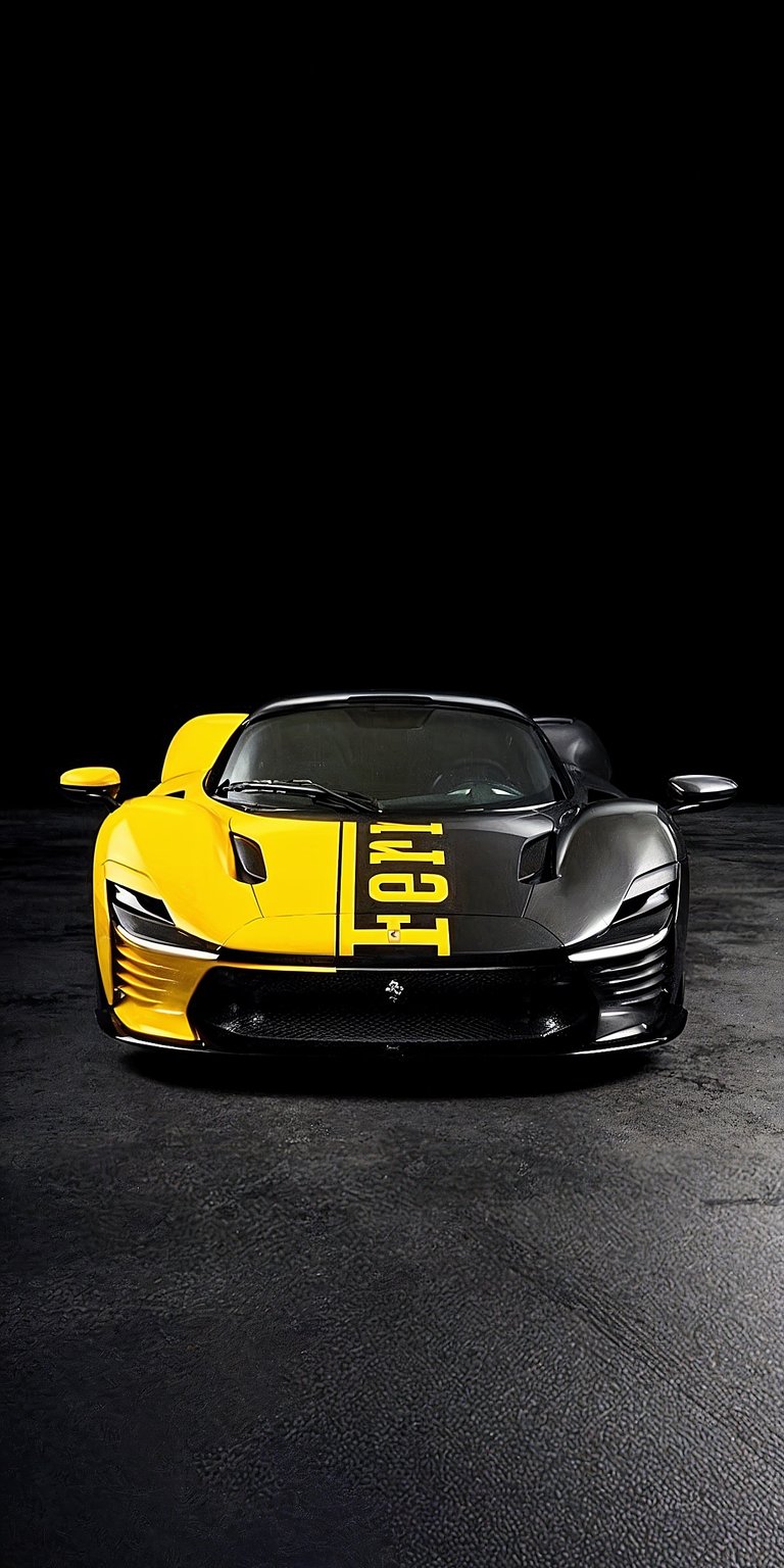 Ferrari Daytona SP3 Static wallpaper featuring a bold yellow body, aggressive front design, and dark studio background. This aesthetic wallpaper highlights sharp lines and glossy details, perfect for iPhone lock screen and home screen displays.