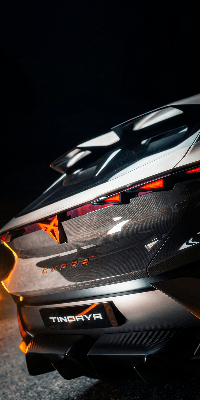 This Cupra DarkRebel wallpaper showcases the dramatic rear diffuser and the illuminated logo. It is a premium aesthetic wallpaper for iPhone that captures the "Tindaya" inspired design language in a sports car frame.