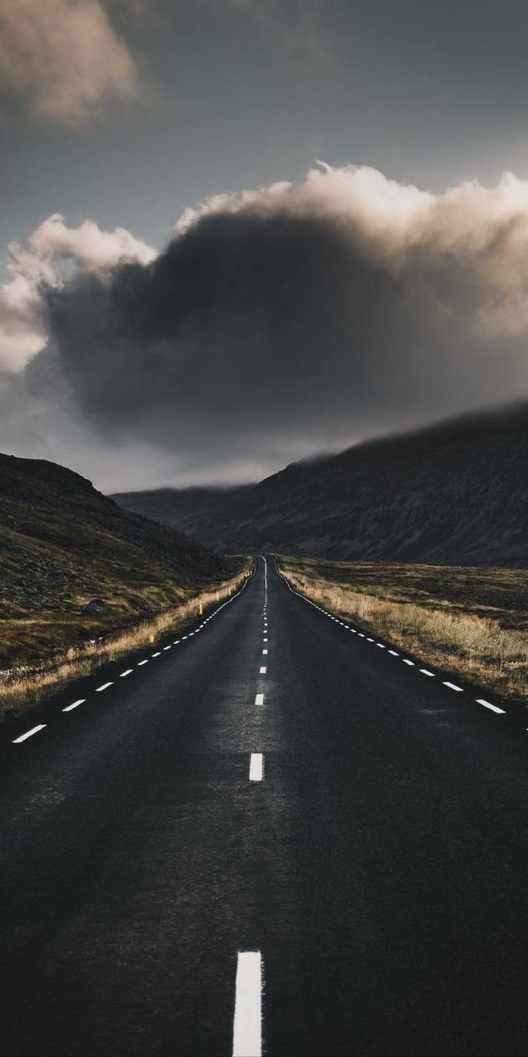 Straight road with a cloud and mountain view wallpaper