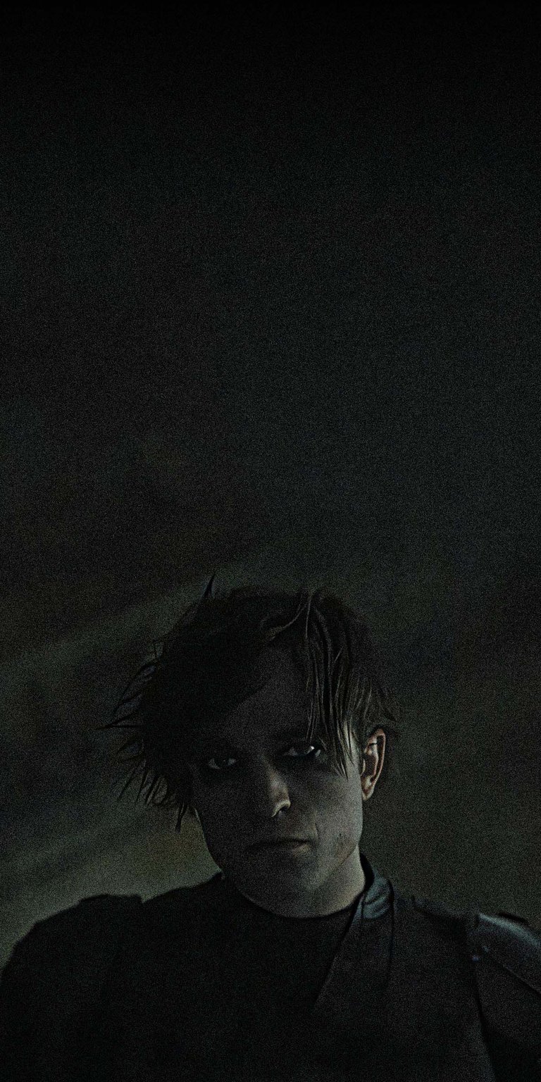 Download this striking Batman Robert Pattinson 4K wallpaper for your iPhone today. This wallpaper features Robert Pattinson as Batman with dark eye makeup and tousled hair.