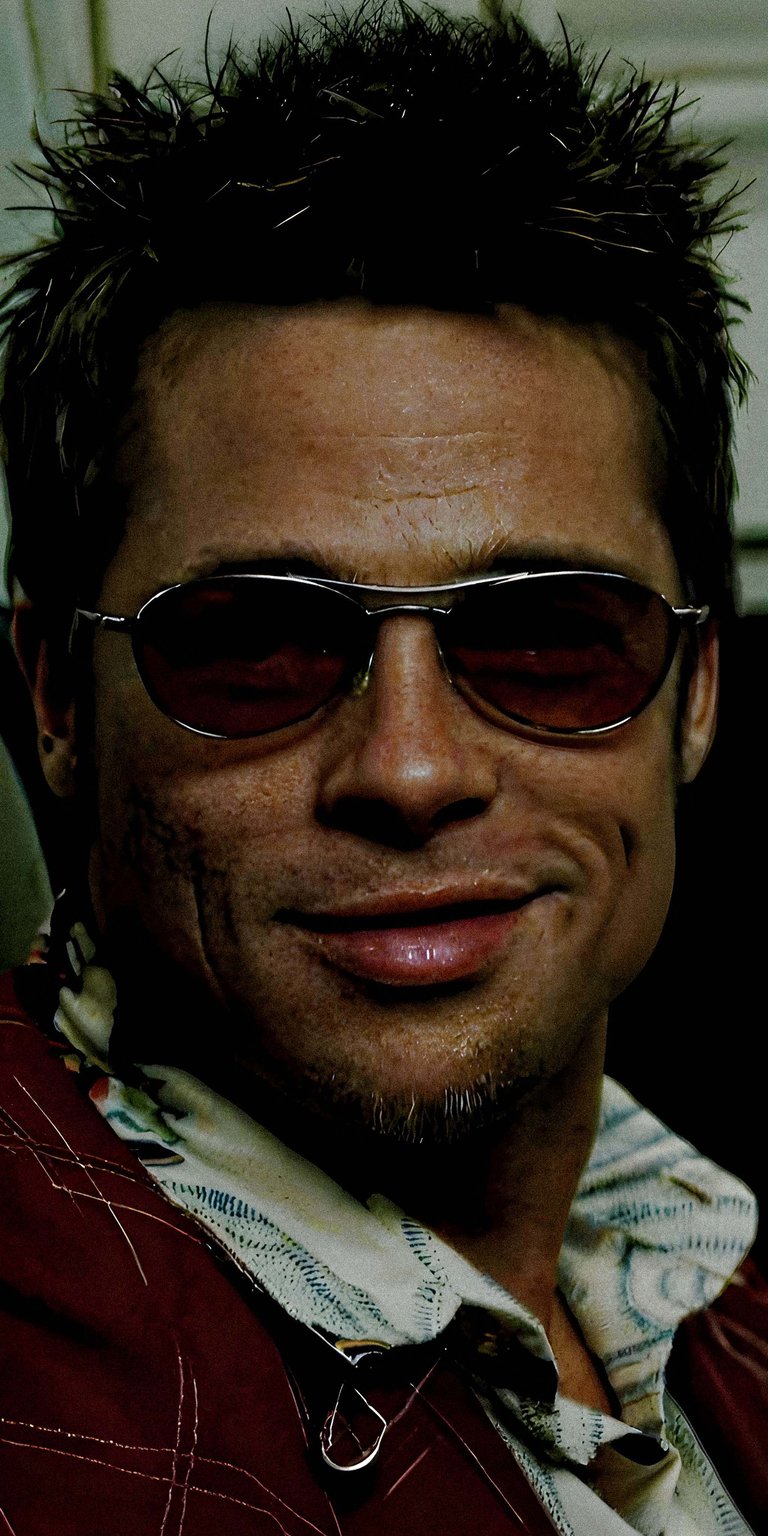 Get this Tyler Durden 4K wallpaper for your iPhone, featuring his spiky hair, smirk, and rose-tinted sunglasses. This wallpaper captures his iconic look.