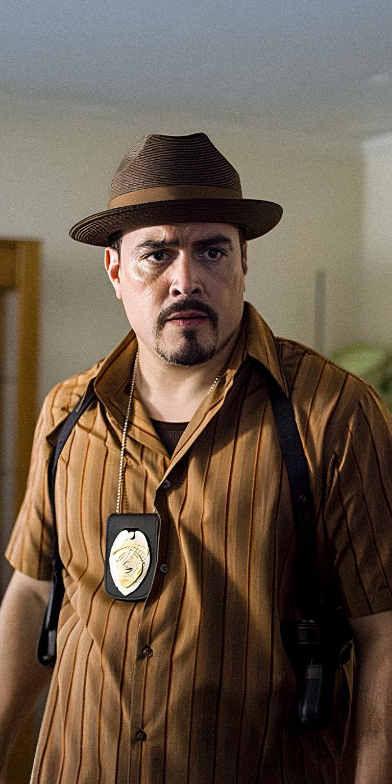 Angel Batista wearing police badge wallpaper