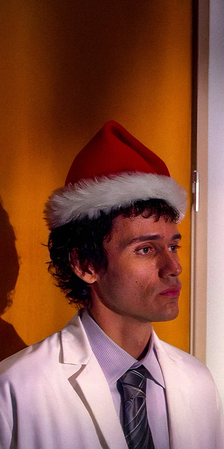 Dexter Morgan wearing santa hat iPhone wallpaper