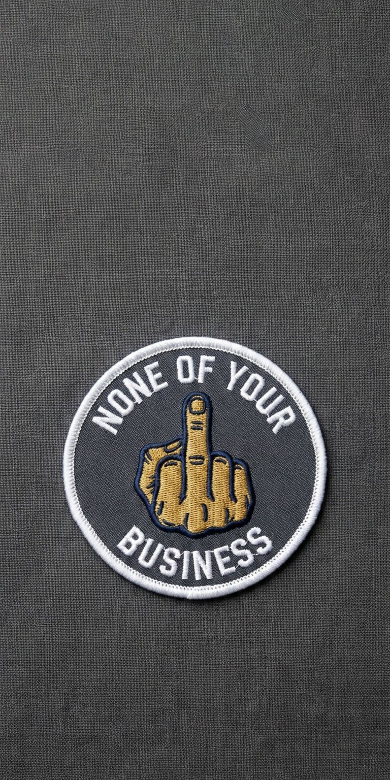 A textured grey background featuring a bold "None of your business" patch graphic. This aesthetic wallpaper adds a touch of attitude to your iPhone.