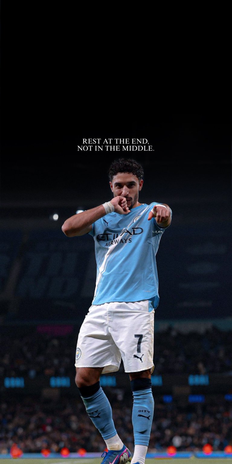 Marmoush 4K wallpaper designed for OLED / AMOLED wallpapers, featuring deep black negative space and focused stadium lighting. This wallpaper is optimized for iPhone, highlighting light blue tones, sharp subject contrast, and a confident goal-celebration mood.