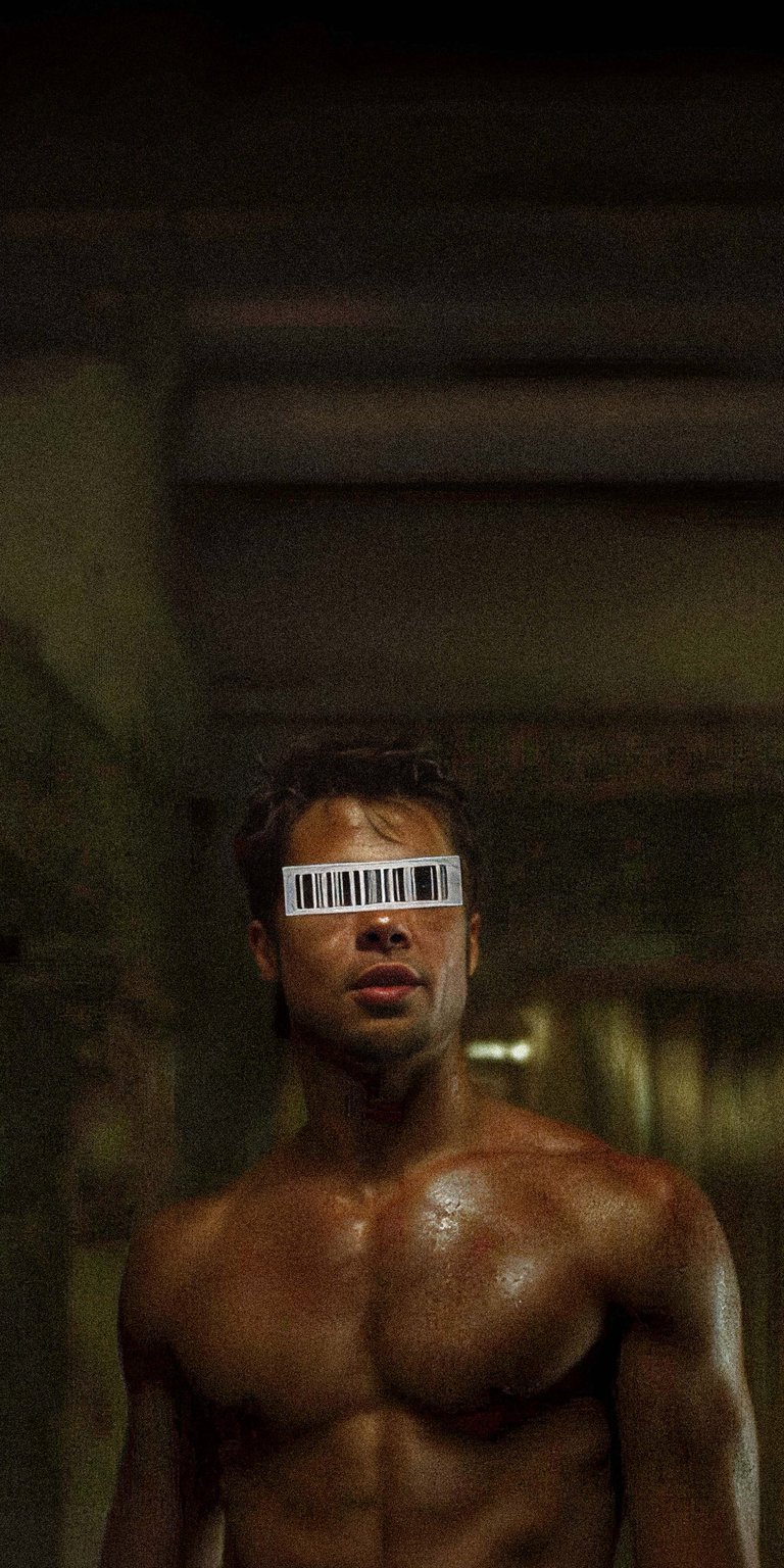 Download this intense Tyler Durden 4K wallpaper for your iPhone, showcasing his barcode-covered eyes. The sweat glistens on his chest, set against a gritty, industrial backdrop, making it a striking wallpaper choice.