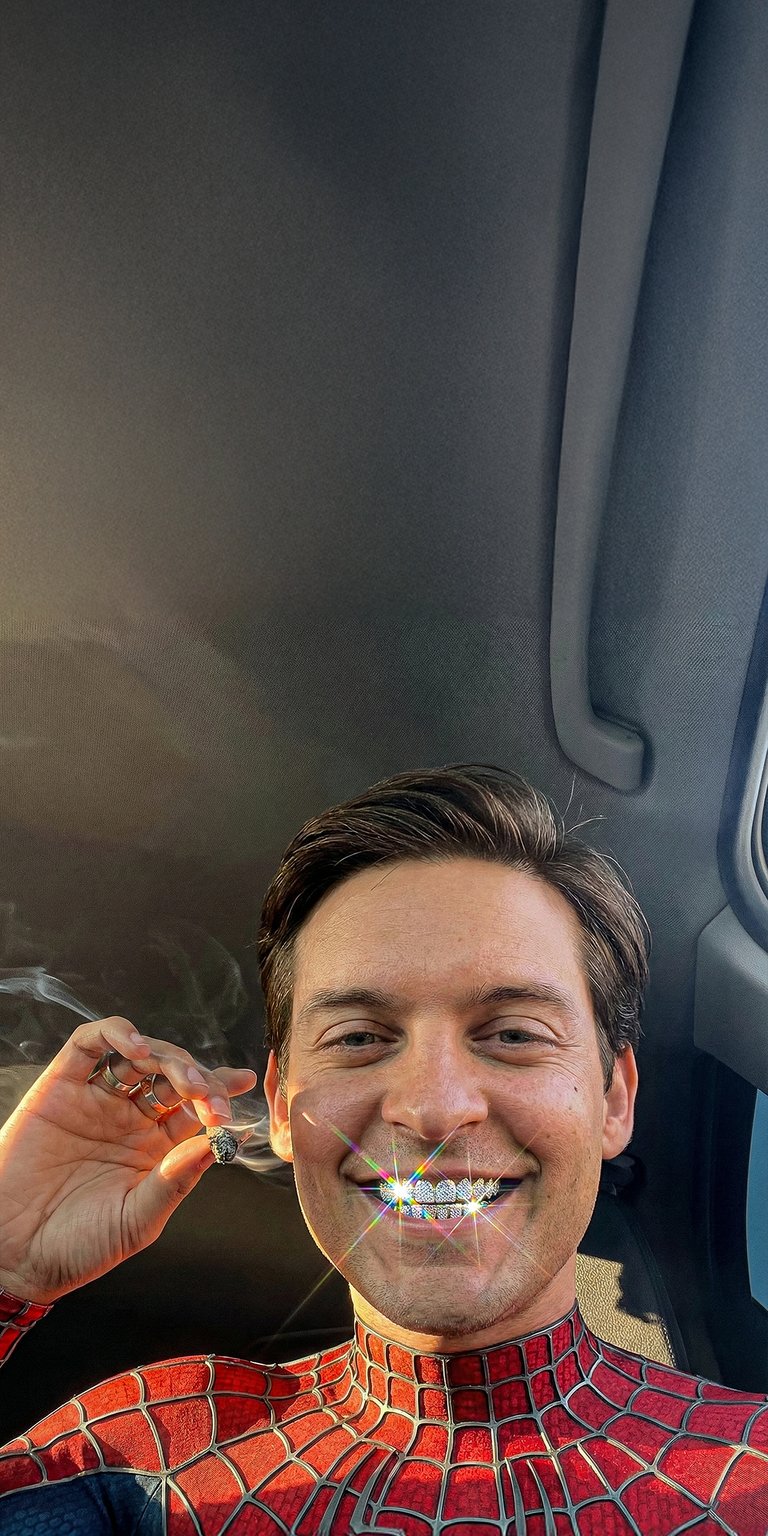This unique 4K aesthetic wallpaper features Tobey Maguire as Spider-Man sporting iced-out diamond grillz. Perfect for your iPhone, this wallpaper showcases vibrant red suit textures and sparkling light flares in a humorous, high-quality car selfie style.