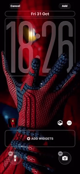 Download this Spiderman 4K wallpaper for your iPhone, featuring the striking red and blue honeycomb pattern on his suit. The hero reaches out with his hand, illuminated by the light, with his iconic yellow eyes in the shadows.