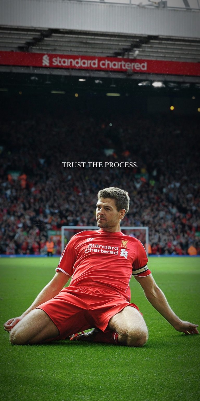 A legendary tribute to the iconic Liverpool FC Captain, Steven Gerrard! This live wallpaper captures a classic moment of the midfield maestro on the pitch at Anfield, wearing the famous red kit. The image is overlaid with the motivational quote, "TRUST THE PROCESS," embodying the dedication and fighting spirit Gerrard was known for. This is an essential piece for any true fan of the Reds, commemorating one of the greatest players in Premier League history. Download this high-quality wallpaper and keep the spirit of a true leader on your screen!
