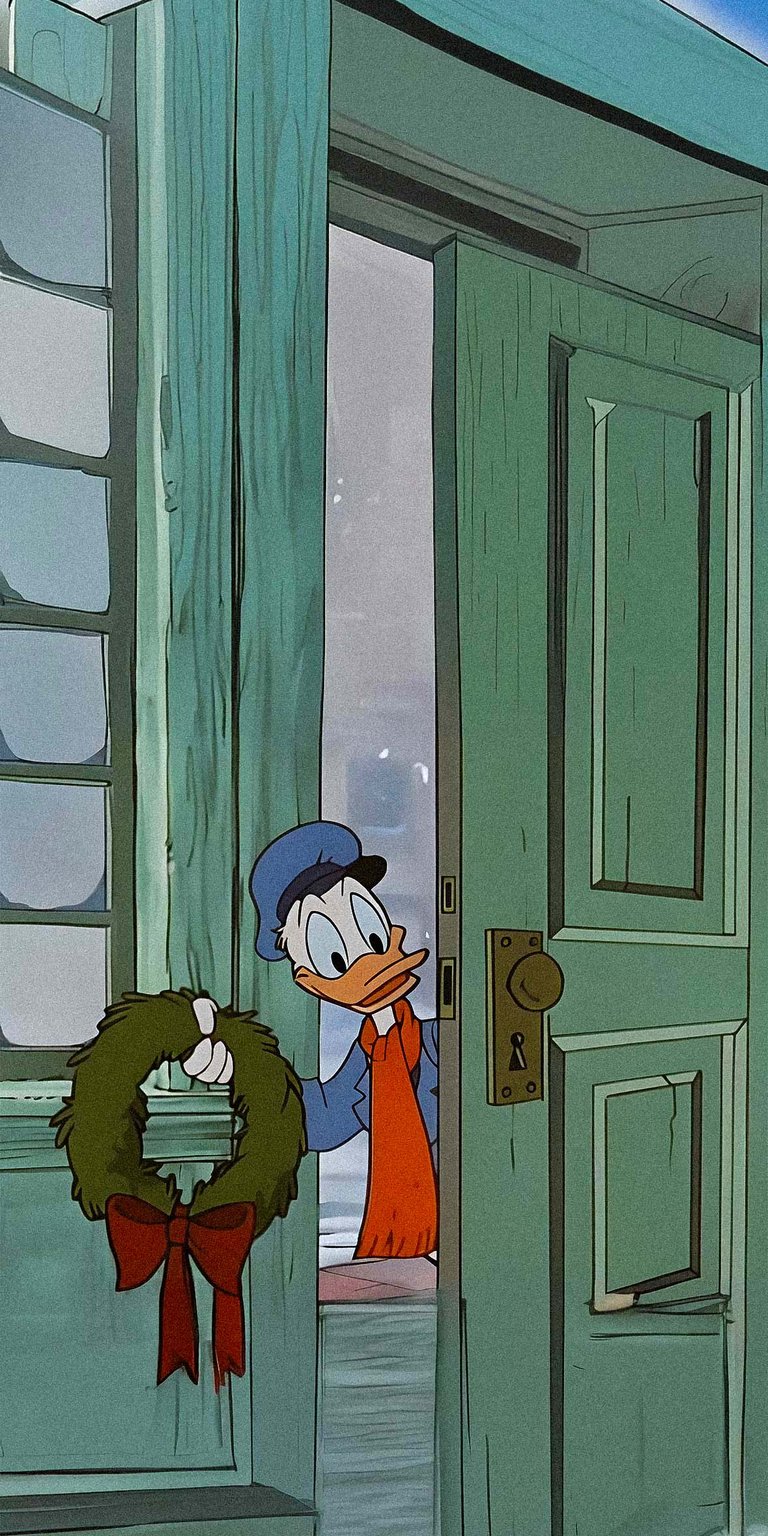 Donald Duck holding a christmas decoration wallpaper 4k iPhone