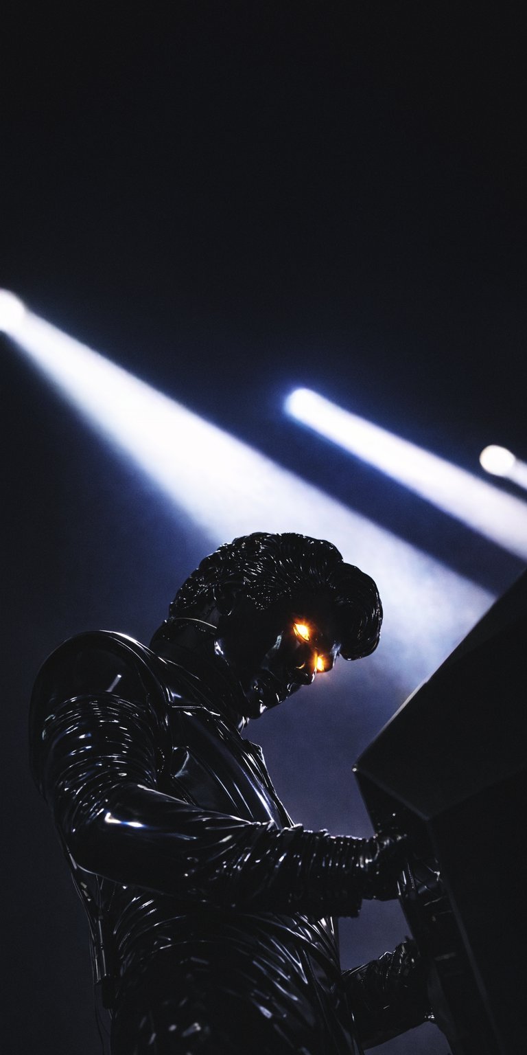 Gesaffelstein wallpaper for iPhone presented in a cinematic side profile with glossy black textures and glowing amber eyes. This Aesthetic wallpapers style wallpaper uses dramatic spotlight lighting, deep shadows, and strong contrast for a dark, immersive mood.