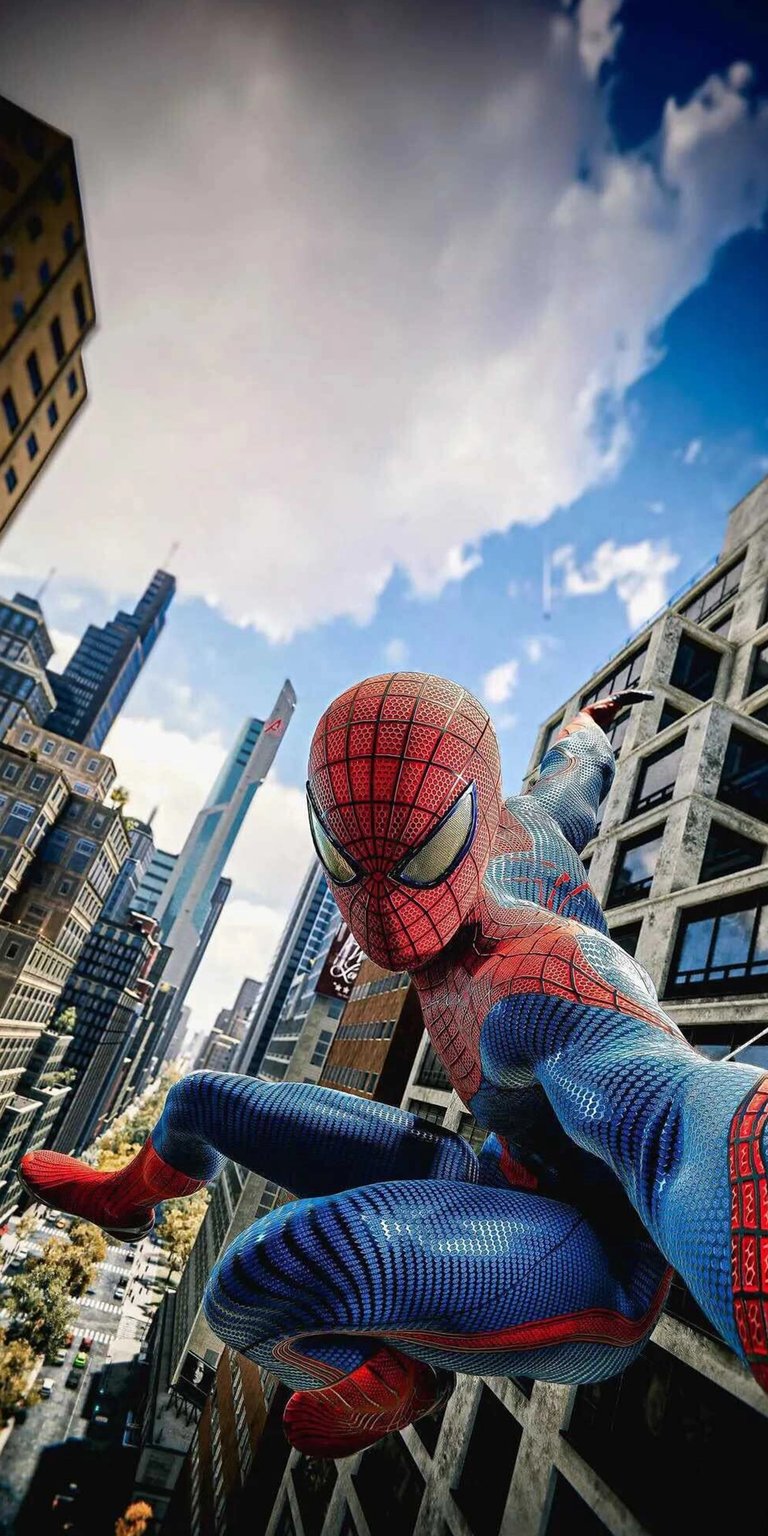 Download this stunning Spiderman 4K wallpaper for your iPhone, showcasing the iconic superhero in a dynamic pose. The wallpaper features Spiderman set against a backdrop of modern skyscrapers and a vibrant blue sky with fluffy clouds.