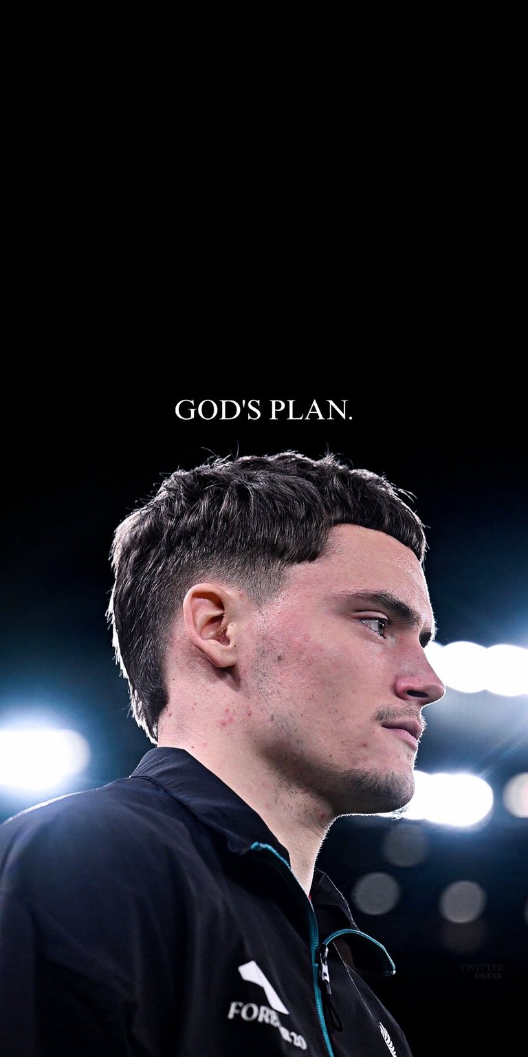 A striking sports wallpaper featuring Florian Wirtz looking upward against a dark background with stadium illumination. This aesthetic wallpaper offers a moody and professional look for your iPhone.